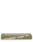 Floral-patterned pencil with green box on a white background