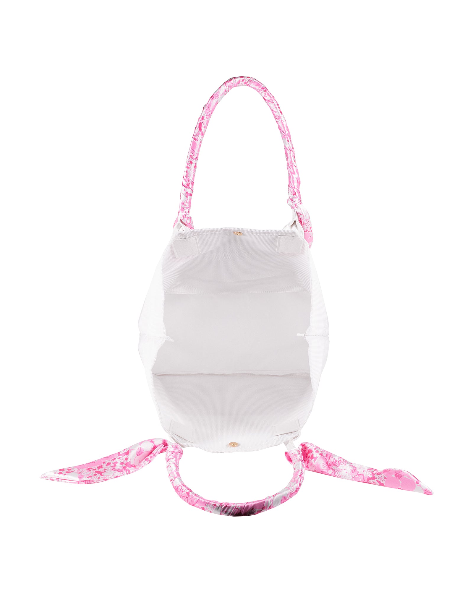interior of white mesh tote beach bag with pink and white floral handles