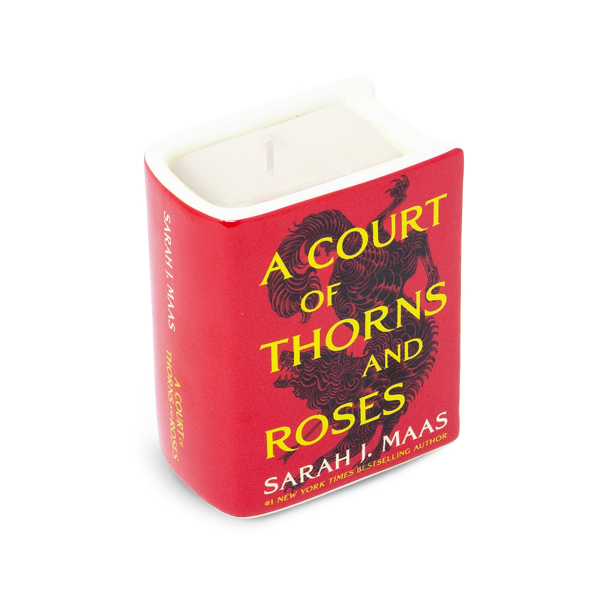 A square-shaped white candle in a red container with yellow text reading 'A COURT OF THORNS AND ROSES' and the author name Sarah J. Maas, shown on a white background.