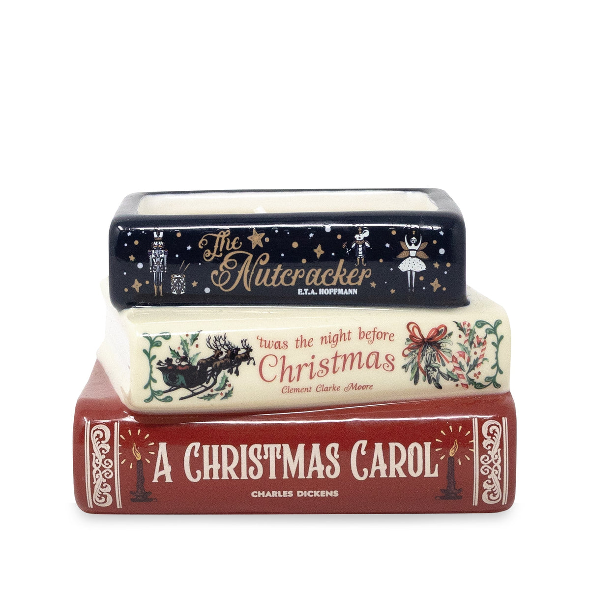 A ceramic Christmas-themed book stack figurine featuring 'The Nutcracker' on top, followed by 'The Night Before Christmas', and 'A Christmas Carol' on the bottom.