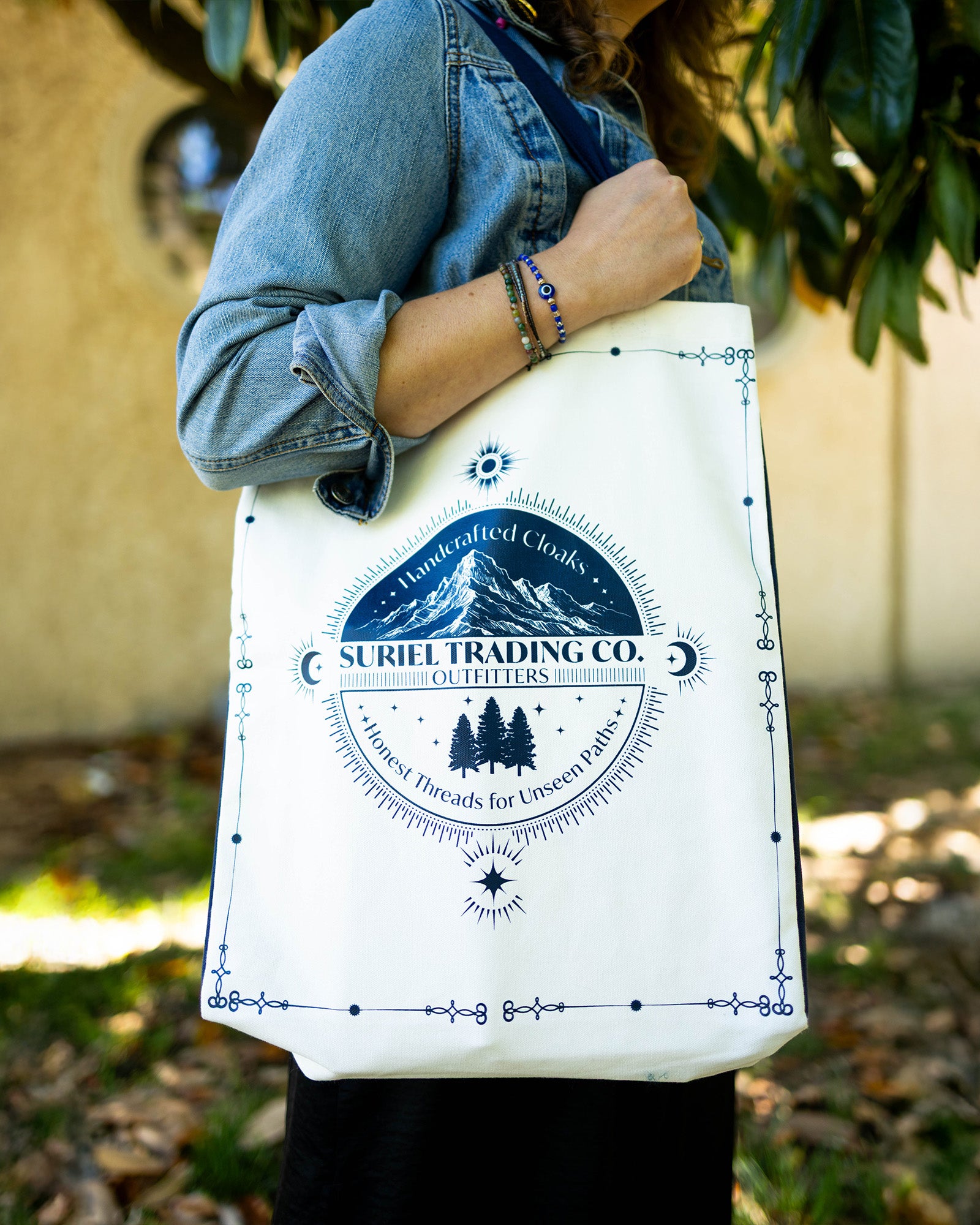 model carrying white suriel trading co tote bag