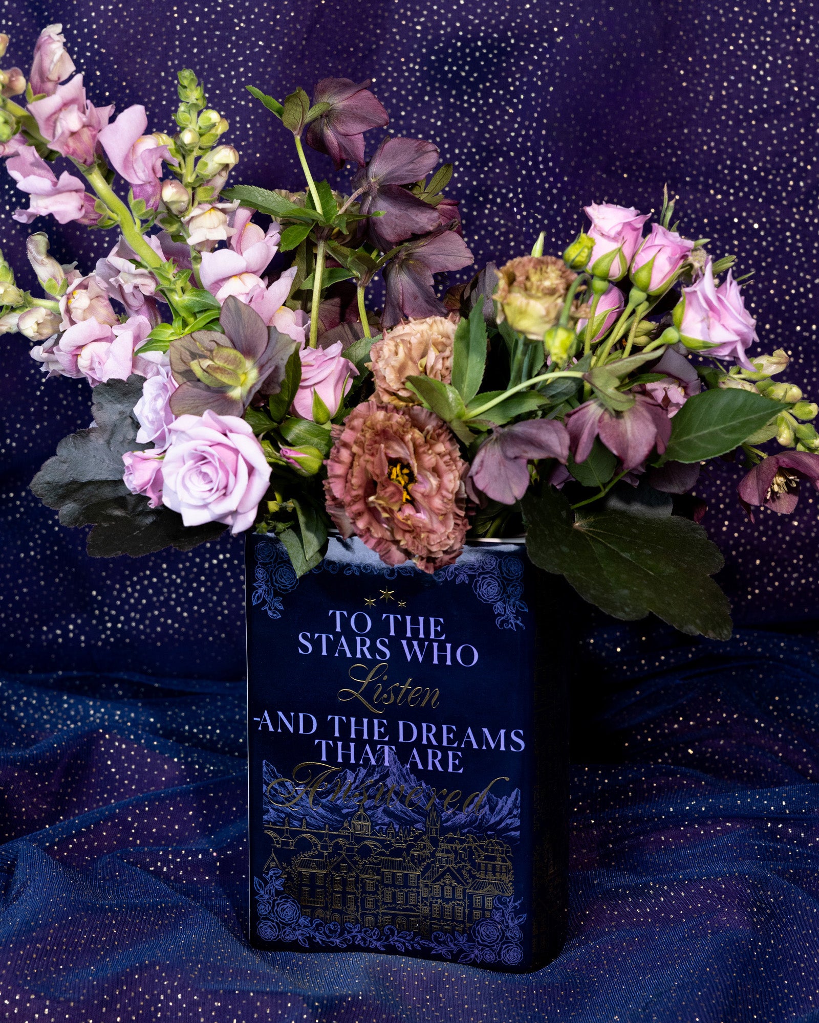 back view of Book-shaped vase with 'Velaris' design with a bouquet inside