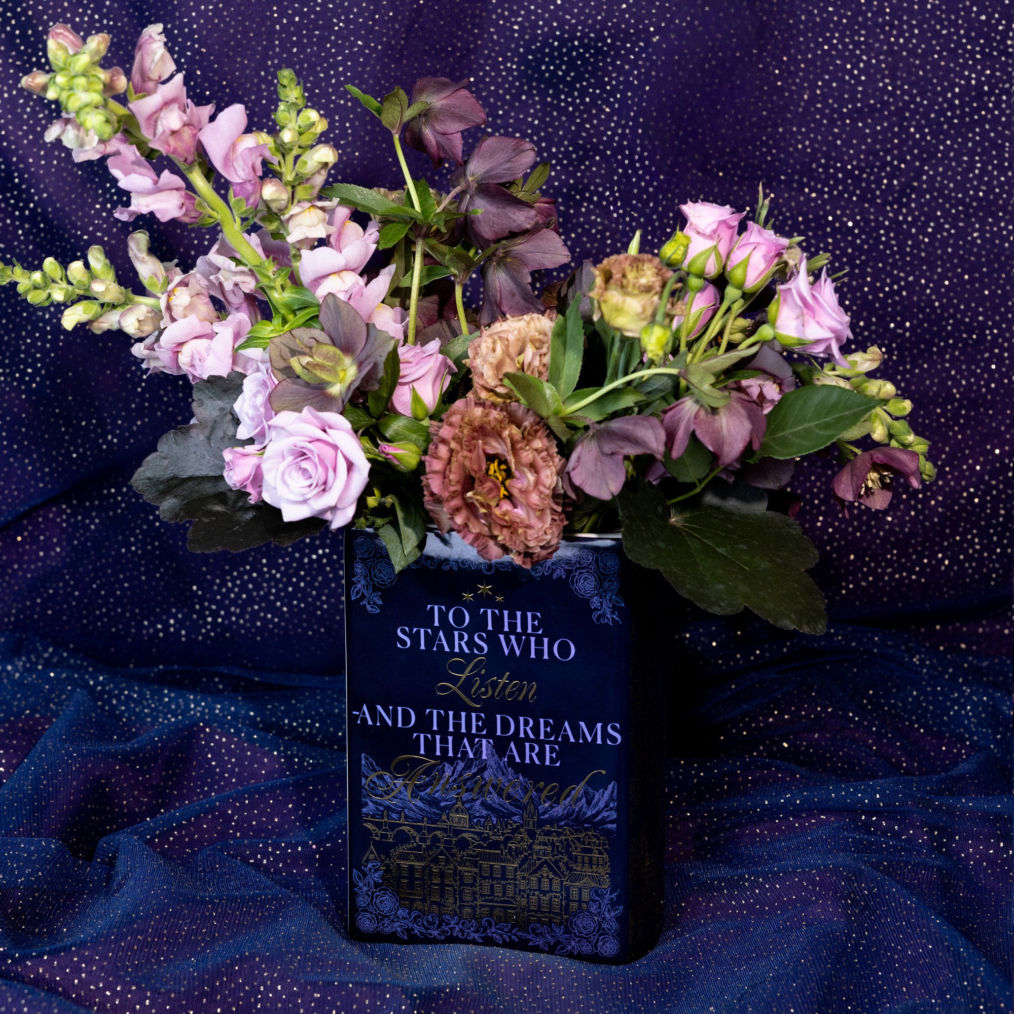 back view of Book-shaped vase with 'Velaris' design with a bouquet inside