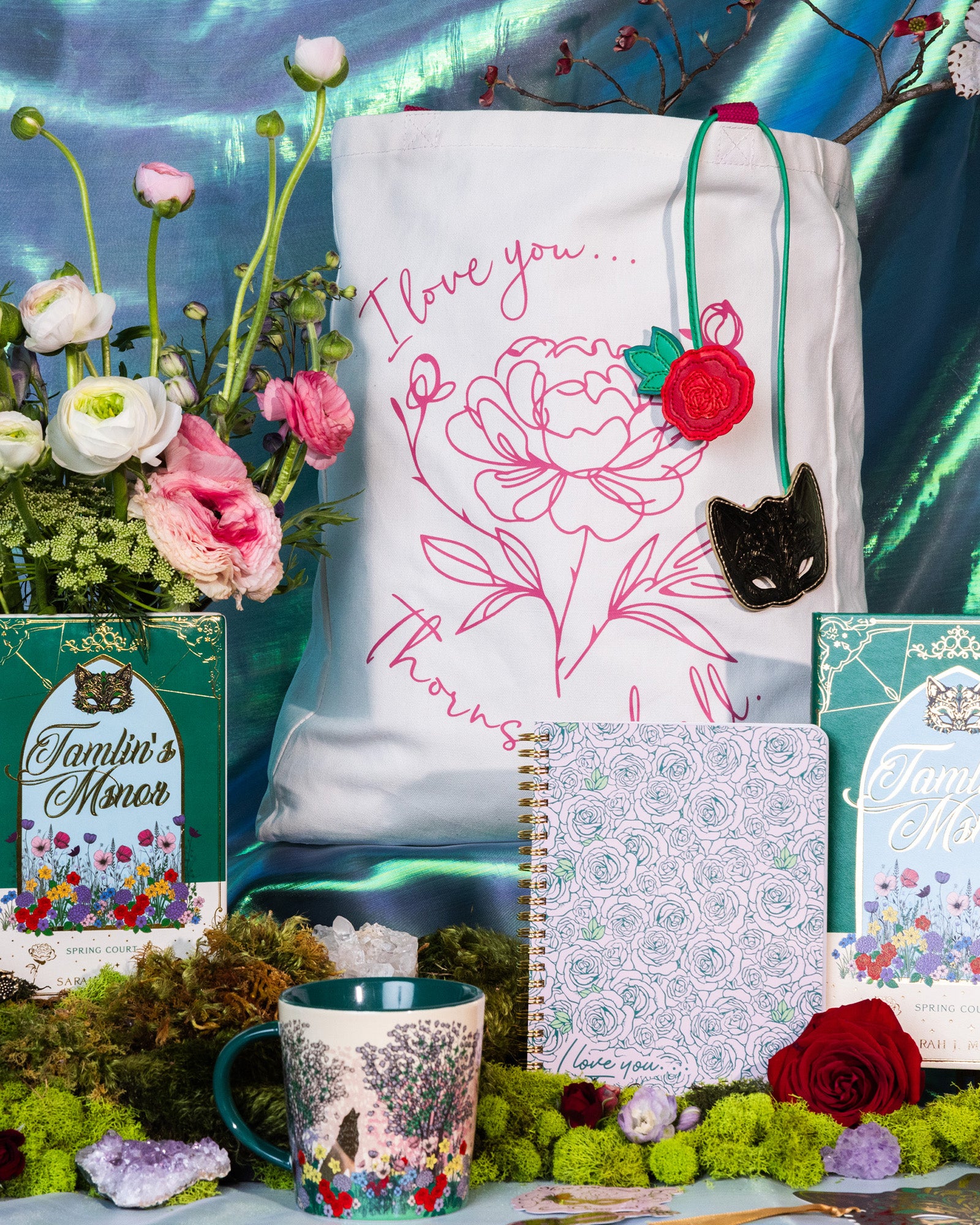 Mug with floral design surrounded by other tamlin's manor themed items