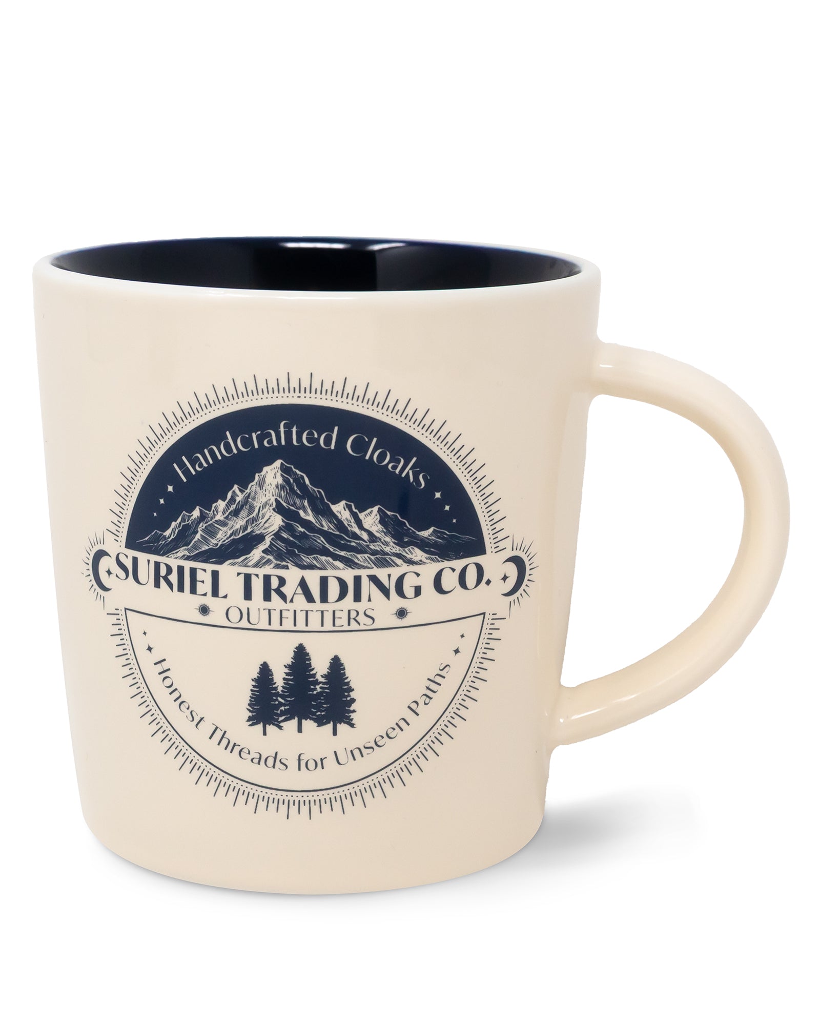 Beige mug with mountain and tree design and 'Suriel Trading Co.' text on a white background