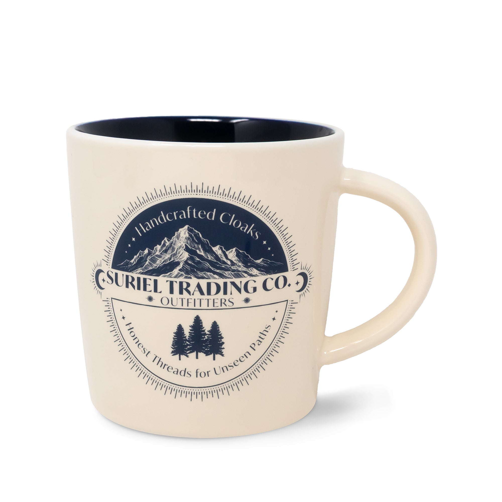 Beige mug with mountain and tree design and 'Suriel Trading Co.' text on a white background