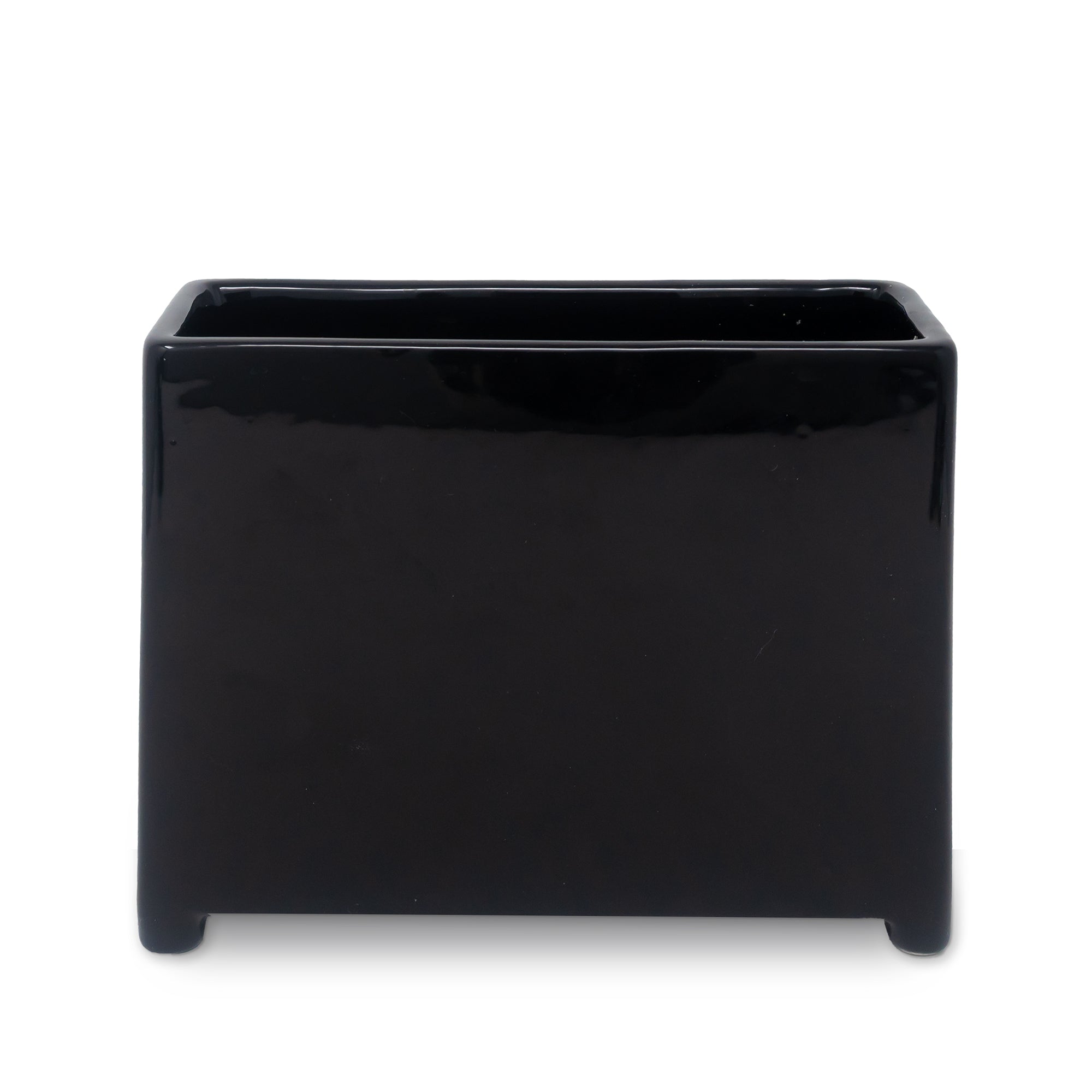 back view of black planter with floral and fiery designs on a white background