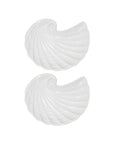 Two white shell-shaped plates on a white background