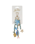 Decorative keychain with fish design on a white background