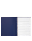 Open notebook with blue cover and white lined pages on a white background