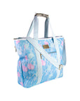 Blue floral-patterned tote bag with white straps on a white background