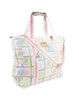 Patterned handbag with a shoulder strap on a white background