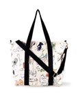 Tote bag with black straps and a colorful pattern on a white background