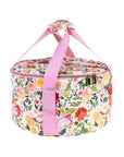 Side view of Floral-patterned dutch over carrier with pink handle on a white background