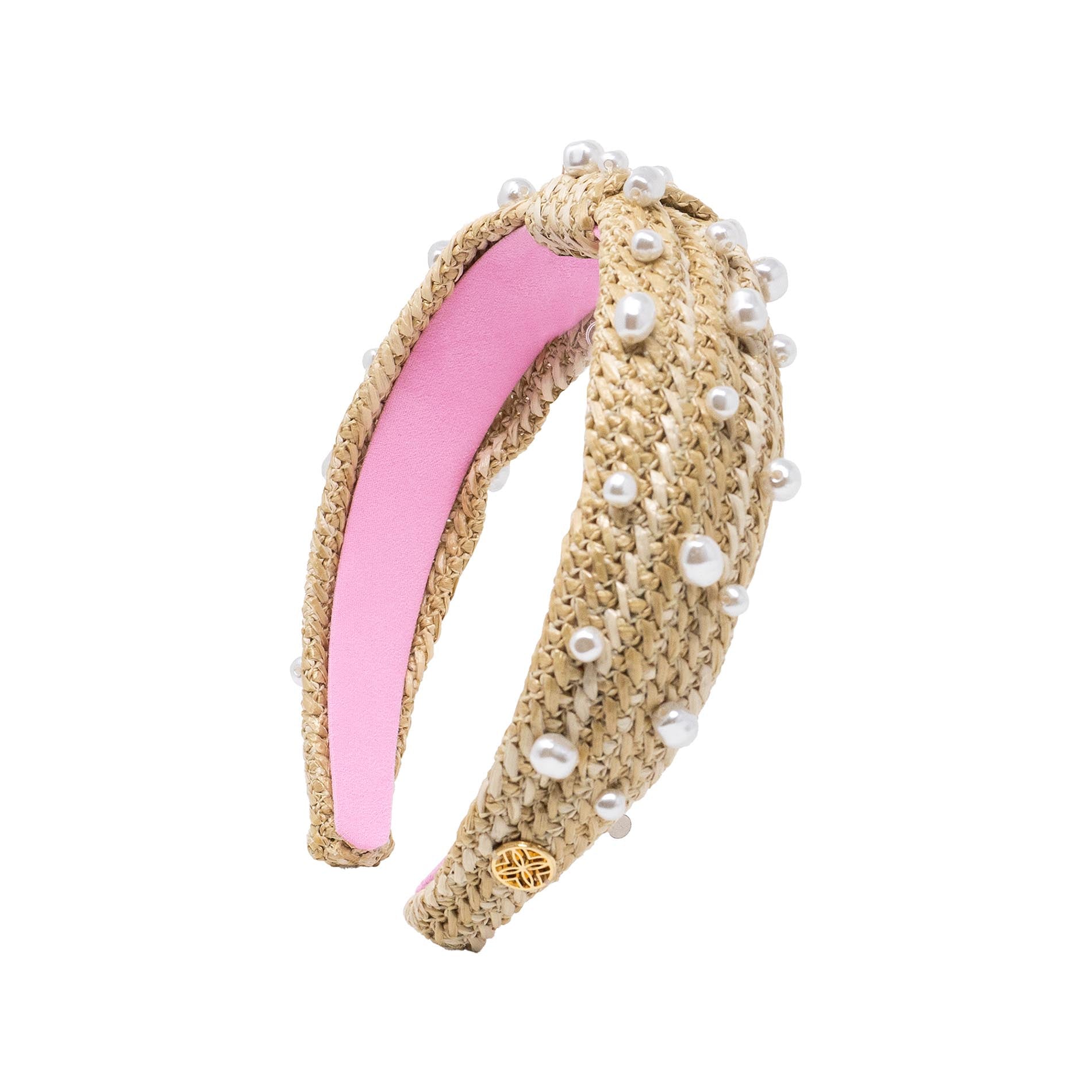 Headband with pink center and beige woven design on a white background
