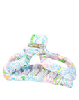 Colorful hair clip with floral pattern on a white background