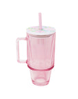 Pink tumbler with handle and straw on a white background