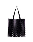 Black tote bag with white polka dot pattern on a white background