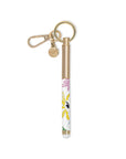 Gold pen with floral design and keychain on a white background