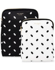 Two polka dot pouches from Kate Spade on a white background