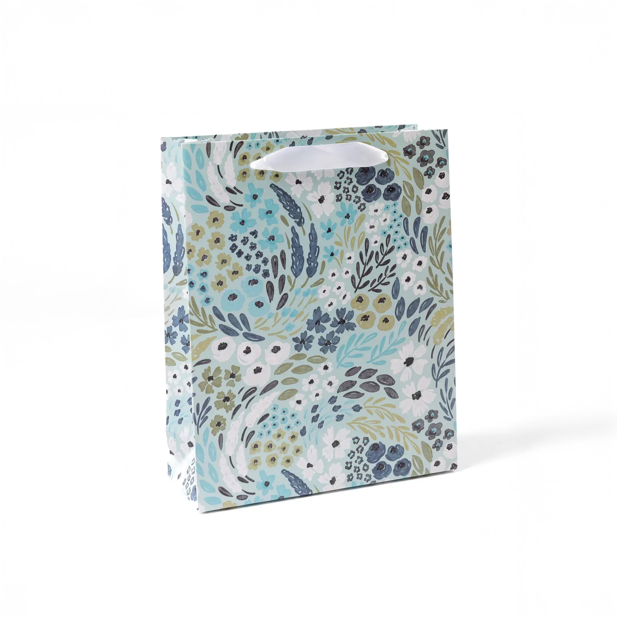 Blue floral medium gift bag with white handle and on a white ground