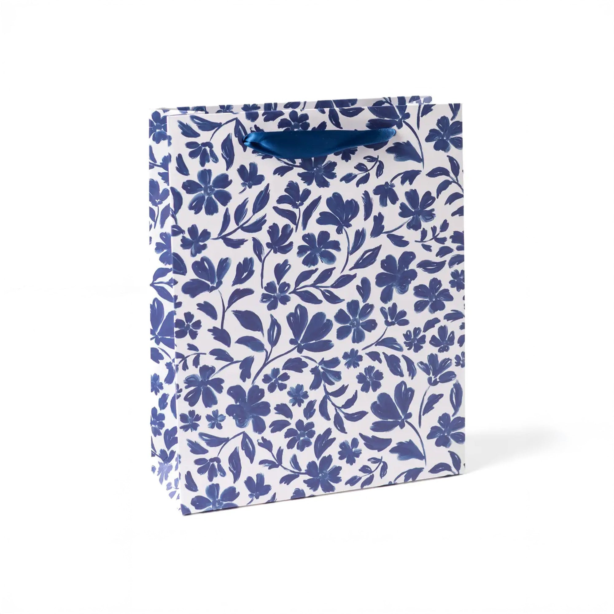 White large gift bag with blue straps and blue porcelain floral print