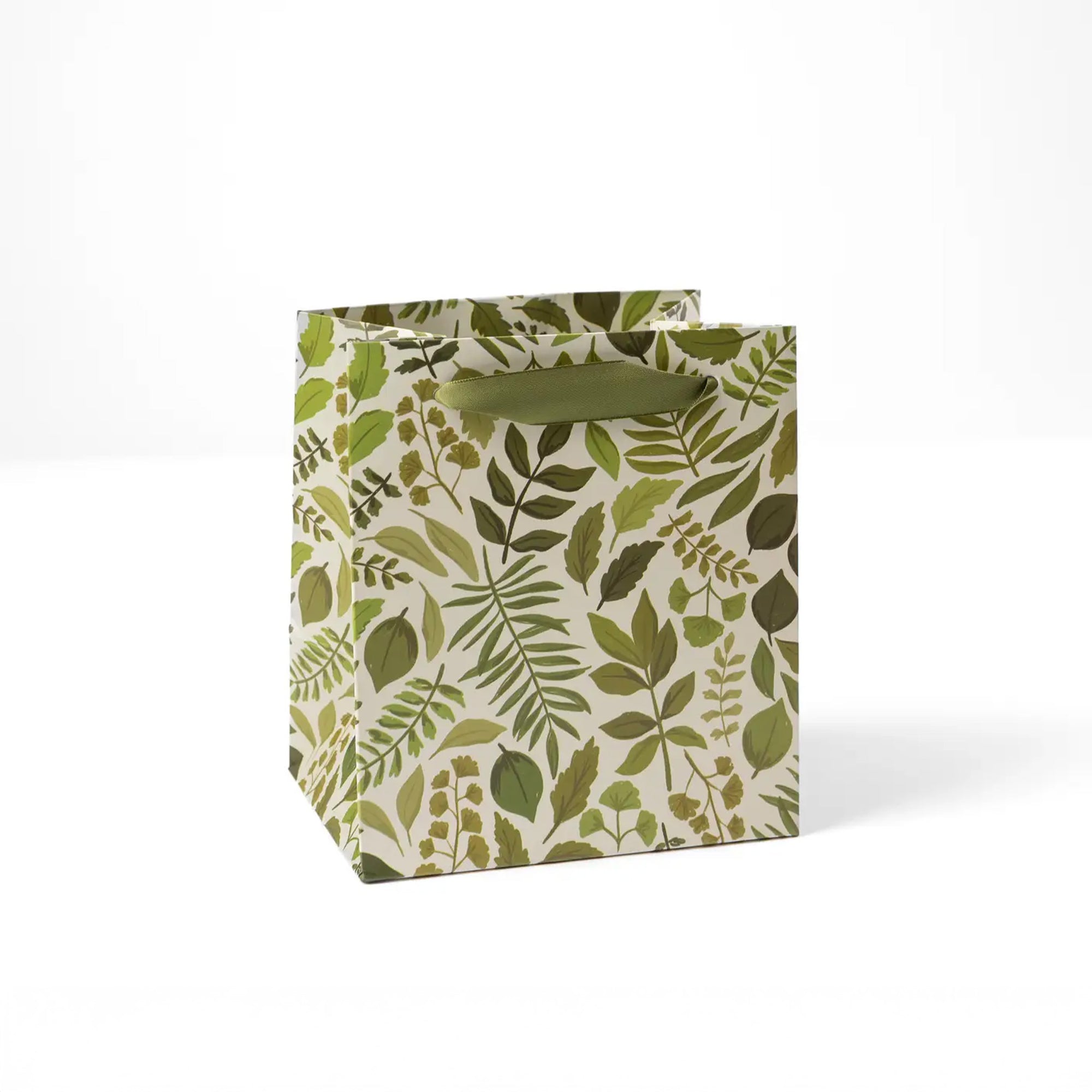 Small tan gift bag with all over green leaf print