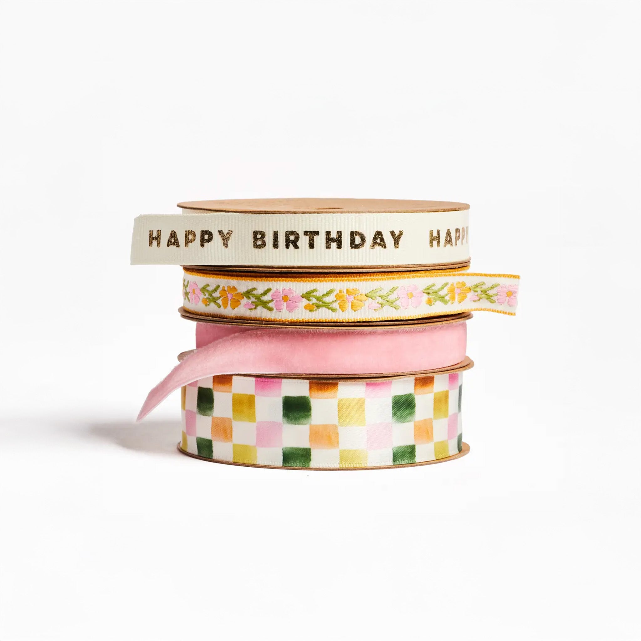set of 4 birthday and celebration ribbons: Checkered Satin Ribbon, Cream grosgrain ribbon printed with gold foil "Happy Birthday", Rose velvet ribbon, and Pink vine floral woven ribbon