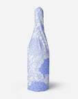 Bottle wrapped with white and lavender floral tissue paper