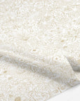 Up close of decorative tissue paper with gold floral pattern