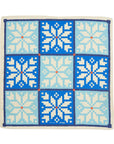 Square scarf with pixelated snowflake pattern in blue and white on a white background