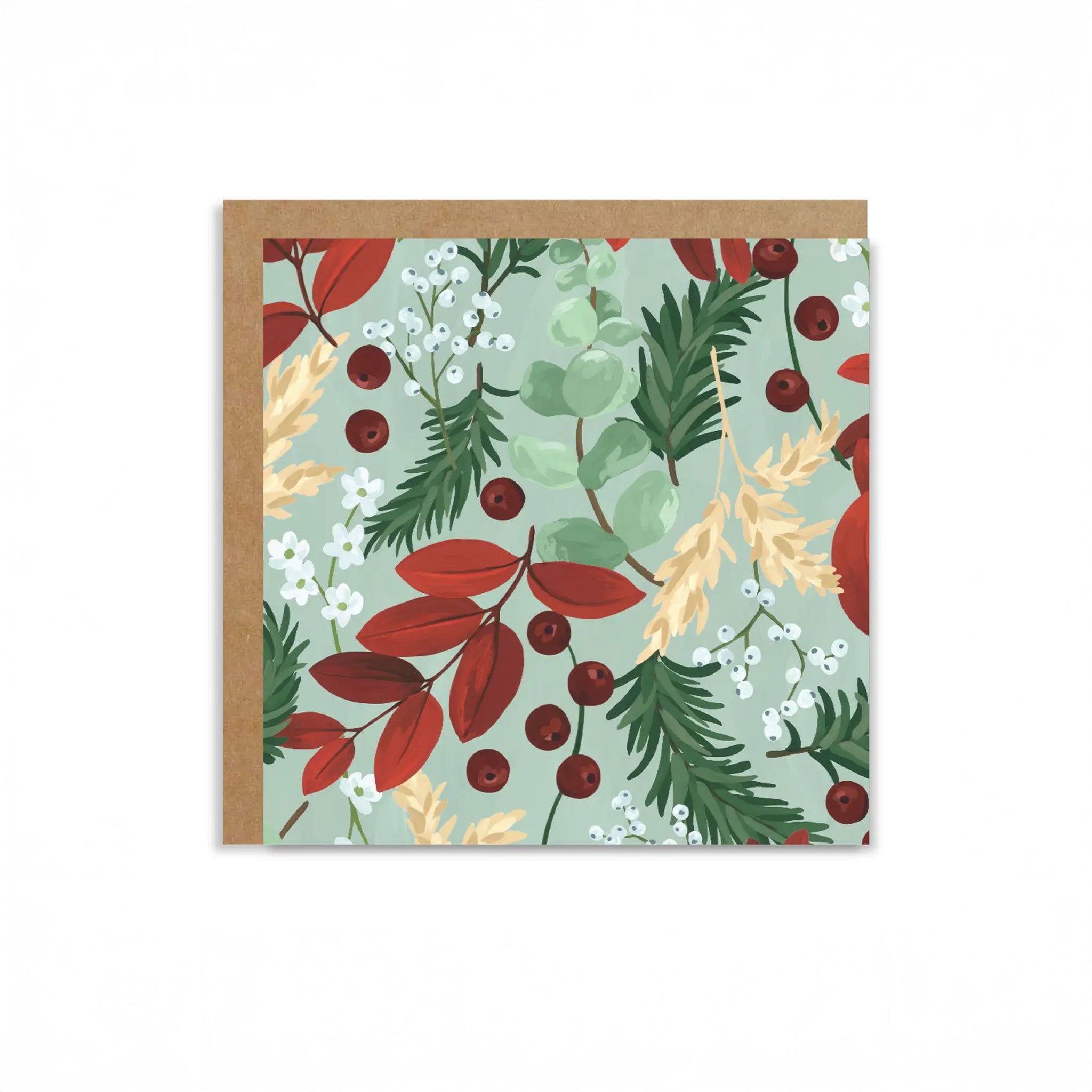 Greeting card with a floral design featuring red leaves, greenery, and berries on a light blue background.