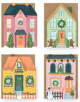 Four colorful house-shaped greeting cards with Christmas-themed decorations on a white background.