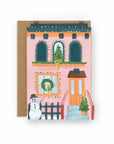 Greeting card with a festive house illustration and snowman on a white background