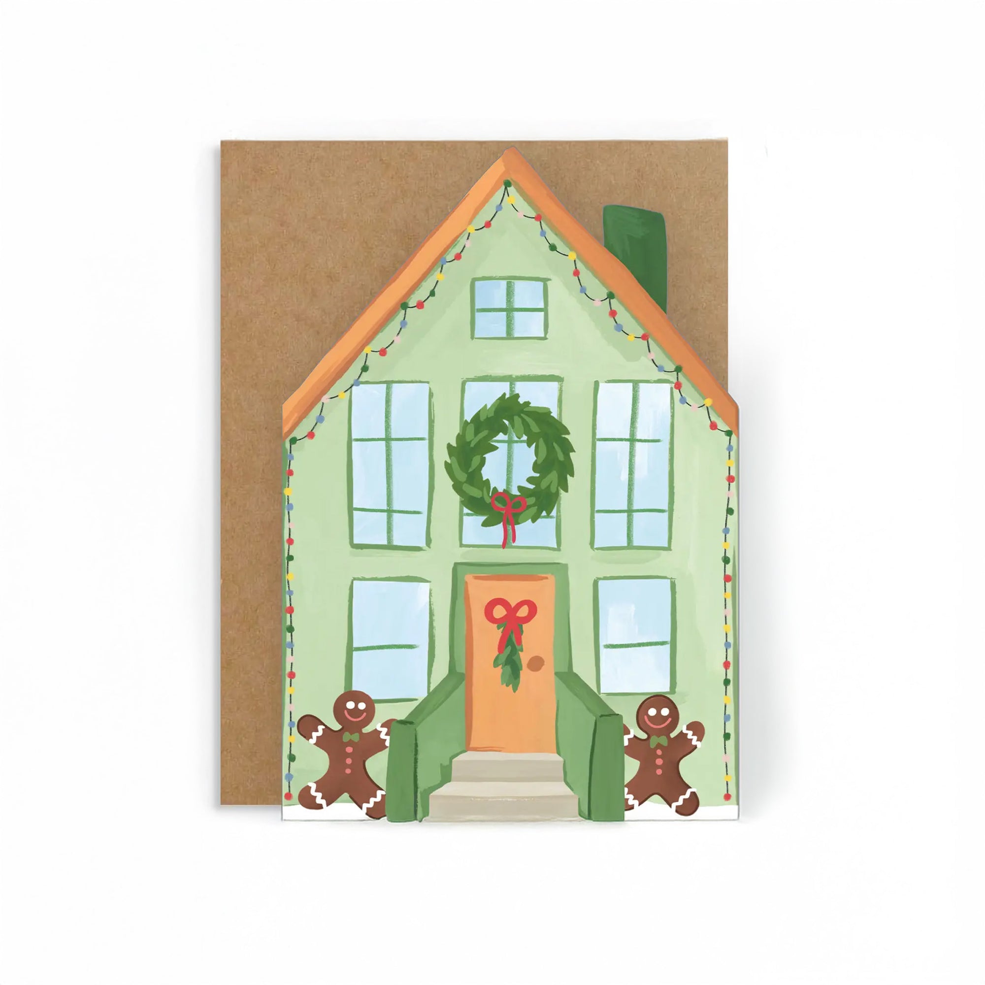 Christmas-themed house card with a wreath, gingerbread men, and a brown envelope.