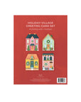 Holiday Village greeting card set packaging with colorful houses on a red background