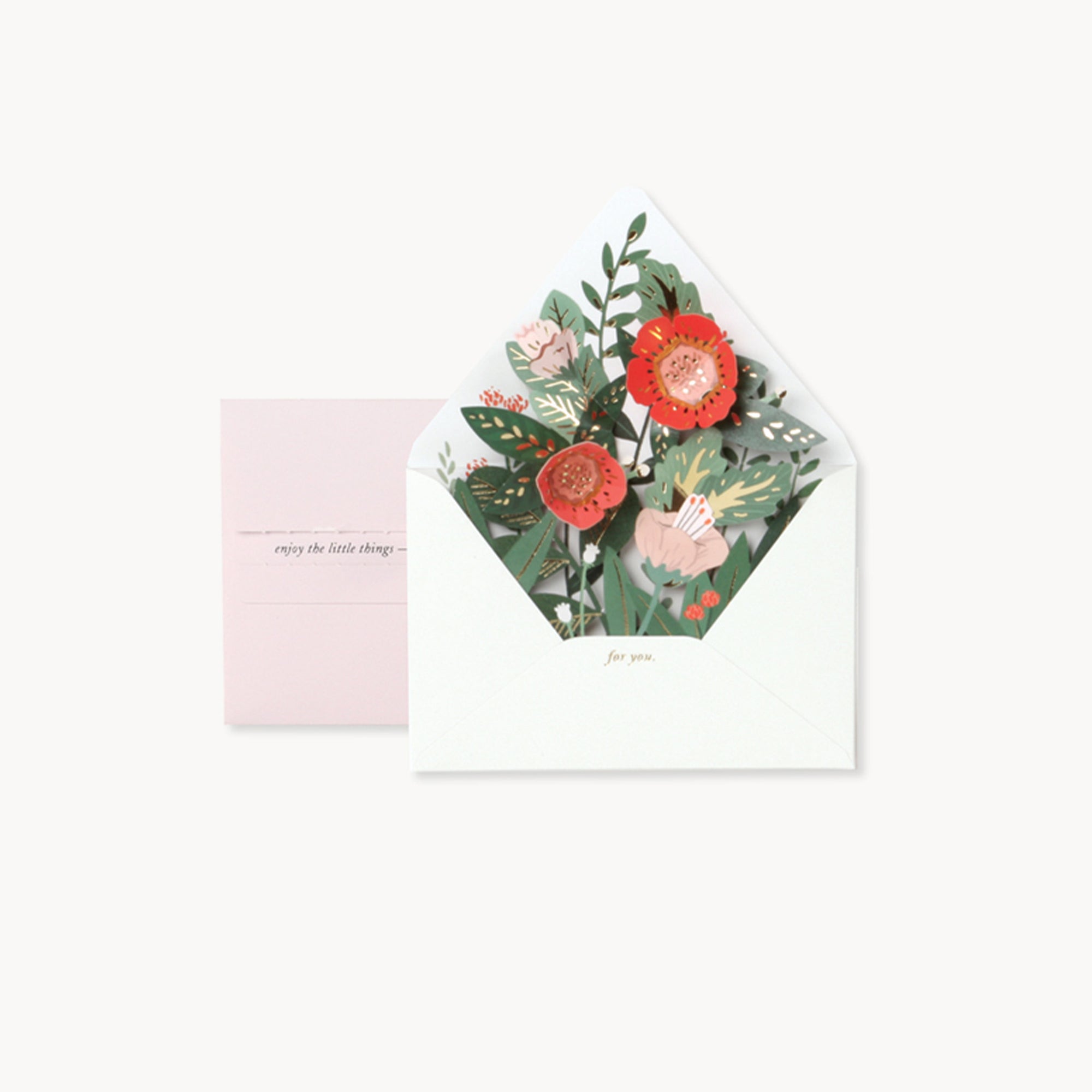 Floral design on an envelope and pink card with text