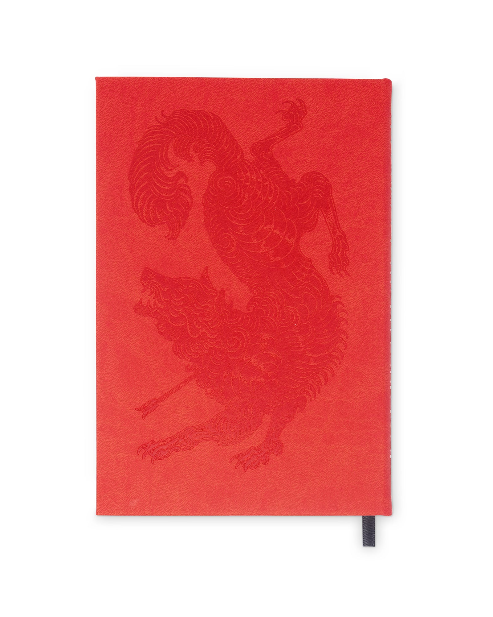 Red notebook with a dragon design on a white background