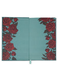 Teal notebook with red rose pattern on a white background