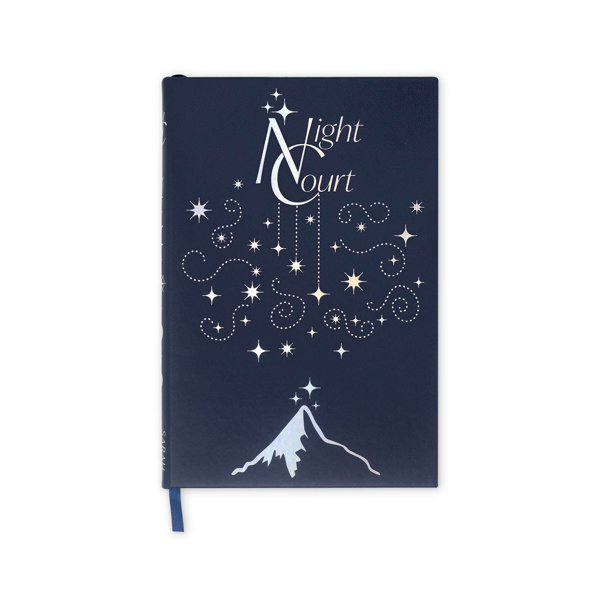 Navy blue notebook with white star design and mountain illustration on a white background