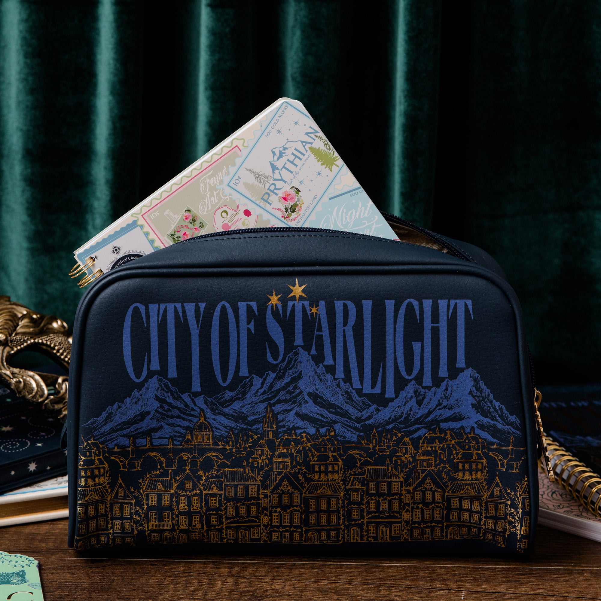 Navy blue bag with 'City of Starlight' design on a dark background