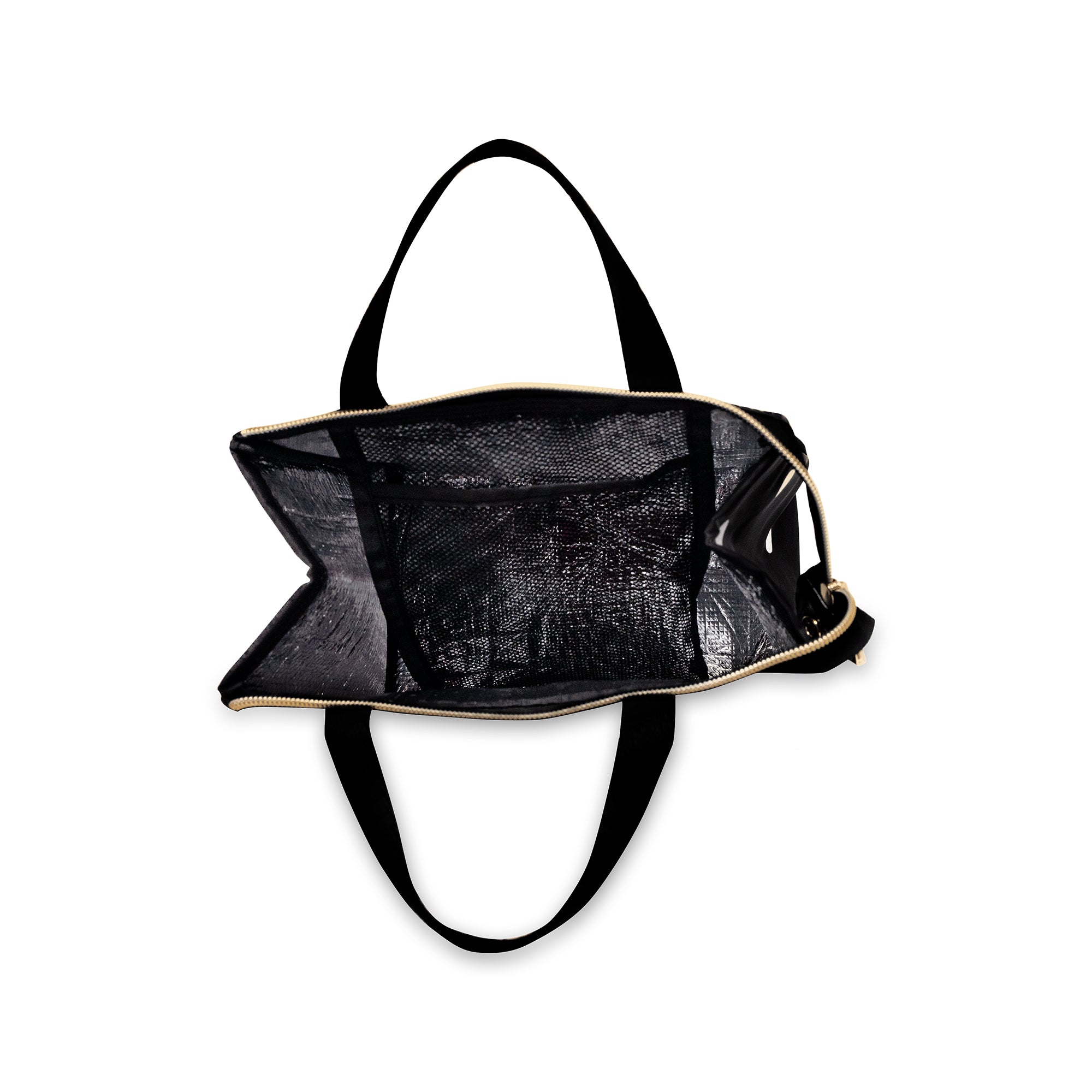 interior of black lunch bag with white polka dots