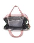 Pink pet carrier with mesh side on a white background