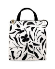 White lunch bag with black floral pattern on a white background