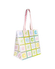 Tote bag with colorful square patterns on a white background