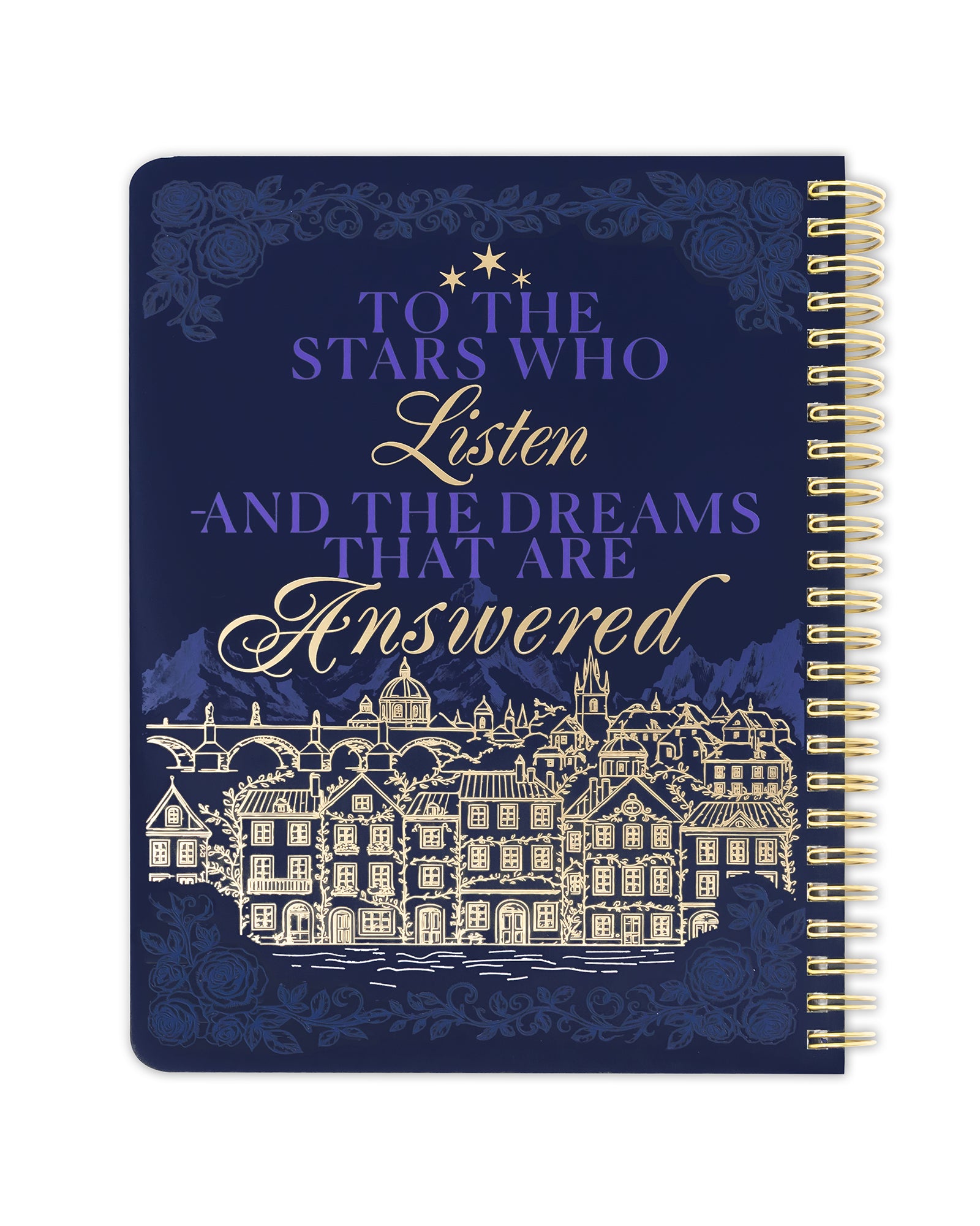 Notebook with decorative cover featuring text and architectural illustration on a white background