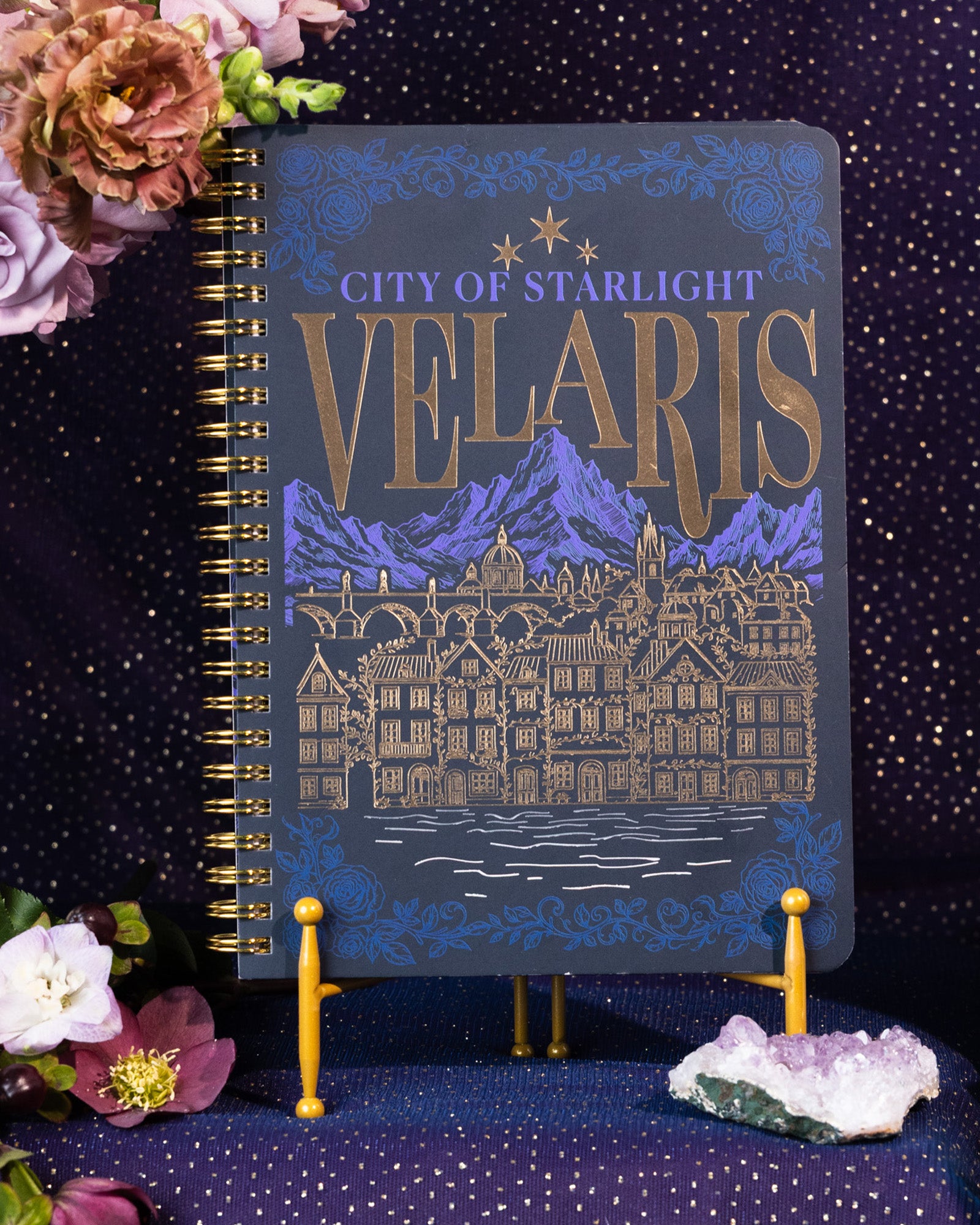 Notebook with 'City of Starlight Velaris' design on a sparkly background
