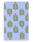 Notebook with green turtle pattern on a blue background