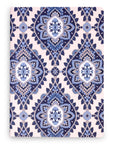 Notebook with blue and white geometric pattern on a white background