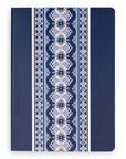 Navy blue notebook with a decorative pattern on a white background